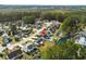 Aerial view of neighborhood featuring manicured lawns, a community pond, and a peaceful setting at 658 Pamlico Ct., Myrtle Beach, SC 29588