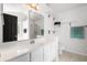 Bright bathroom with a white vanity, framed mirror, tiled floors and a shower with glass door at 658 Pamlico Ct., Myrtle Beach, SC 29588