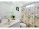 This bathroom offers a shower with a patterned curtain and a neutral color palette at 658 Pamlico Ct., Myrtle Beach, SC 29588