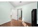 Bright bedroom features laminate wood flooring and a closet with bi-fold mirror doors at 658 Pamlico Ct., Myrtle Beach, SC 29588