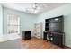 This bedroom features laminate wood flooring and built in dark vanity desk with display shelving at 658 Pamlico Ct., Myrtle Beach, SC 29588