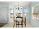 Bright dining area with an abundance of windows, flooding the space with natural light, and a cozy atmosphere at 658 Pamlico Ct., Myrtle Beach, SC 29588