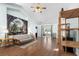 Open-concept living room with wood flooring, high ceiling, and sliding doors to the patio and backyard at 658 Pamlico Ct., Myrtle Beach, SC 29588