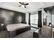 Main bedroom features decorative tray ceiling, dark accent wall and dark marble nightstands at 658 Pamlico Ct., Myrtle Beach, SC 29588