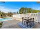 Outdoor patio with a dining set, overlooking the pool and lush greenery, perfect for relaxing at 658 Pamlico Ct., Myrtle Beach, SC 29588