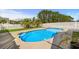 Backyard pool featuring a sleek design, surrounded by lush greenery, ideal for relaxation and recreation at 658 Pamlico Ct., Myrtle Beach, SC 29588