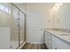 Bright bathroom featuring a glass shower, granite countertop, and modern vanity with wood-look flooring at 716 Lapwind Loop, Myrtle Beach, SC 29579