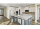 Bright kitchen with a large island, quartz countertops, and modern appliances at 716 Lapwind Loop, Myrtle Beach, SC 29579