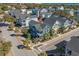 Aerial shot of a blue two-story home in a neighborhood near the ocean at 7624 Azure Dr., Myrtle Beach, SC 29572