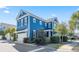 Two-story home featuring a blue exterior, white trim, black shutters, and an attached garage at 7624 Azure Dr., Myrtle Beach, SC 29572