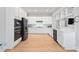 Modern, well-equipped kitchen featuring sleek black appliances, white cabinets, and a minimalist design at 7624 Azure Dr., Myrtle Beach, SC 29572