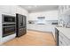 Modern kitchen featuring stainless steel appliances, white cabinetry, and ample counter space for cooking at 7624 Azure Dr., Myrtle Beach, SC 29572