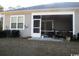 Covered patio offers a tranquil retreat, complete with a bench for relaxation at 8 Vineyard Place # 1, Pawleys Island, SC 29585