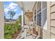 Cozy front porch with seating, offering a peaceful spot to relax and enjoy the neighborhood views at 802 46Th Ave. S, North Myrtle Beach, SC 29582