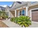 Inviting front porch with comfortable seating and lush plants, perfect for enjoying the outdoors at 802 46Th Ave. S, North Myrtle Beach, SC 29582