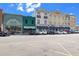 Row of shops and restaurants along a street, with cars parked and sidewalks bustling with activity at 805 Francis Parker Rd., Georgetown, SC 29440