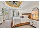 Cozy bedroom features a woven headboard, white bedding, and natural light at 8068 Cortona Dr., Myrtle Beach, SC 29572