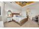 Relaxing bedroom with woven headboard, neutral decor, and ensuite bathroom entrance at 8068 Cortona Dr., Myrtle Beach, SC 29572