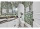 Chic powder room showcasing vibrant wallpaper, white vanity with granite top, and modern fixtures at 8068 Cortona Dr., Myrtle Beach, SC 29572