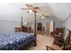 Charming bedroom with a four poster bed, ceiling fans and light gray walls at 823 Mount Gilead Place Dr., Murrells Inlet, SC 29576