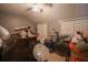 Cluttered bedroom featuring a ceiling fan, dressers, and boxes for storage at 823 Mount Gilead Place Dr., Murrells Inlet, SC 29576