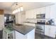 Modern kitchen with stainless steel appliances, white cabinets, and a center island at 823 Mount Gilead Place Dr., Murrells Inlet, SC 29576