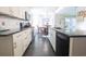 Well-equipped kitchen with stainless steel appliances and a view into the dining area at 823 Mount Gilead Place Dr., Murrells Inlet, SC 29576