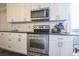 Contemporary kitchen with modern appliances, light cabinetry and subway tile backsplash at 823 Mount Gilead Place Dr., Murrells Inlet, SC 29576