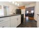 Bright kitchen featuring white cabinets, dark countertops, and stainless steel appliances at 823 Mount Gilead Place Dr., Murrells Inlet, SC 29576