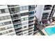 View of multiple balconies with furniture on a high-rise building near a pool at 9400 Shore Dr. # 728, Myrtle Beach, SC 29572