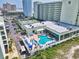 Aerial view of a blue swimming pool with lounge chairs at Sands Beach Club at 9400 Shore Dr. # 728, Myrtle Beach, SC 29572