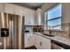 Bright kitchen featuring white cabinets, granite countertops, stainless steel appliances, and tile backsplash at 1000 Cavaletti Ct., Myrtle Beach, SC 29588