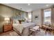 Serene primary bedroom featuring wood accent wall, neutral colors, and large windows at 1000 Cavaletti Ct., Myrtle Beach, SC 29588