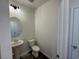 Half bathroom featuring a pedestal sink, toilet, and wood look flooring at 1001 Cavaletti Ct., Myrtle Beach, SC 29588