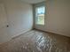 Bedroom with carpet flooring, neutral walls, and a window overlooking the yard at 1001 Cavaletti Ct., Myrtle Beach, SC 29588