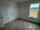 Bedroom with carpet flooring, double door closet, and a window at 1001 Cavaletti Ct., Myrtle Beach, SC 29588