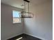 Dining room showcasing a modern light fixture and a window at 1001 Cavaletti Ct., Myrtle Beach, SC 29588