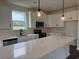 Well-lit kitchen features white cabinets and stainless steel appliances at 1001 Cavaletti Ct., Myrtle Beach, SC 29588