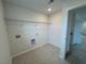 Laundry room with tile flooring, wire shelving, and washer/dryer hookups at 1001 Cavaletti Ct., Myrtle Beach, SC 29588