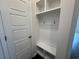Mudroom featuring coat hooks, a bench, and built-in shelving at 1001 Cavaletti Ct., Myrtle Beach, SC 29588