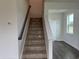 Carpeted staircase with wood railing leading to the next level at 1001 Cavaletti Ct., Myrtle Beach, SC 29588