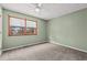 Bedroom features green walls, ceiling fan, tan carpet and a window with wood trim at 1025 Carolina Rd. # R4, Conway, SC 29526