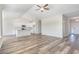 Spacious living area that blends into a modern kitchen, featuring white cabinets and lots of light at 1245 Cypress Shoal Dr., Conway, SC 29526