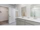 Bathroom featuring a double sink vanity and entry to a walk in closet for optimal storage and convenience at 128 Shucking St., Myrtle Beach, SC 29588