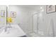Bathroom boasting double sinks with white countertops and a glass-enclosed shower, providing a spa-like experience at 128 Shucking St., Myrtle Beach, SC 29588