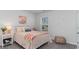 Charming bedroom with a decorative bed frame, natural light from window, and comfortable furnishings at 128 Shucking St., Myrtle Beach, SC 29588