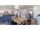 Open dining room featuring a wooden table with view of the kitchen and living room, creating a welcoming atmosphere at 128 Shucking St., Myrtle Beach, SC 29588