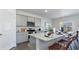 Modern kitchen with granite countertops, stainless steel appliances, gray cabinets and an island with bar stool seating at 128 Shucking St., Myrtle Beach, SC 29588