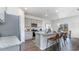 Modern kitchen with granite countertops, stainless steel appliances, gray cabinets and an island with bar stool seating at 128 Shucking St., Myrtle Beach, SC 29588