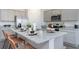 Modern kitchen with granite countertops, stainless steel appliances, gray cabinets and an island with bar stool seating at 128 Shucking St., Myrtle Beach, SC 29588